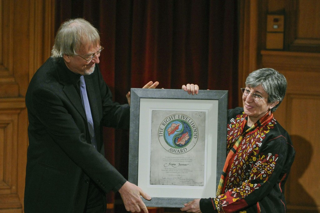 Sima Samar (R) of Afghanistan receive the Right Livelihood Prize from founder Jacob von Uexkull during a ceremony at the Swedish Parliament in Stockholm December 7, 2012. REUTERS/Erik Martensson/Scanpix (SWEDEN - Tags: SOCIETY) SWEDEN OUT. NO COMMERCIAL OR EDITORIAL SALES IN SWEDEN. THIS IMAGE HAS BEEN SUPPLIED BY A THIRD PARTY. IT IS DISTRIBUTED, EXACTLY AS RECEIVED BY REUTERS, AS A SERVICE TO CLIENTS. NO COMMERCIAL SALES - RTR3BBPB