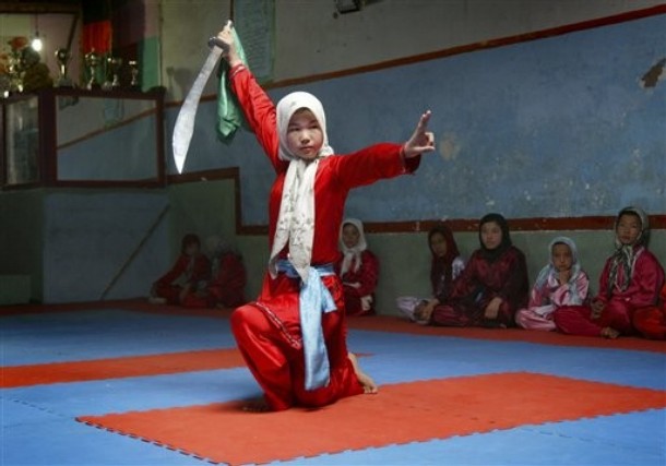 Hazara girl practices the martial arts with a sword A Hazara girl practices the martial arts with a sword at a Wosho training club in Injil, Herat province west of Kabul, Afghanistan on Wednesday, April 6, 2011. (AP Photo)
