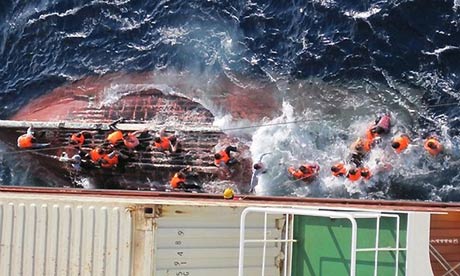 Asylum seekers from Pakistan are rescued by the JPO Vulpecula in 2012 after their boat sank. Photograph: guardian.co.uk