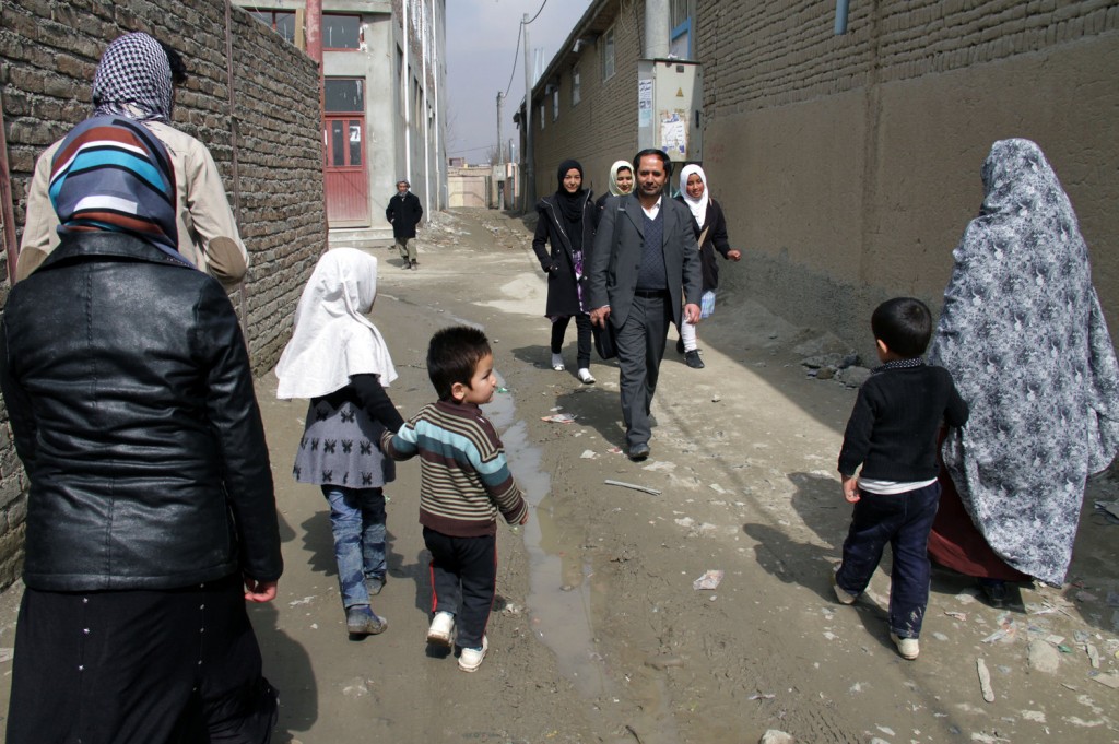 Aziz Royesh (center) in the streets near the Marefat School in Kabul. Zabihullah Tamanna for NPR