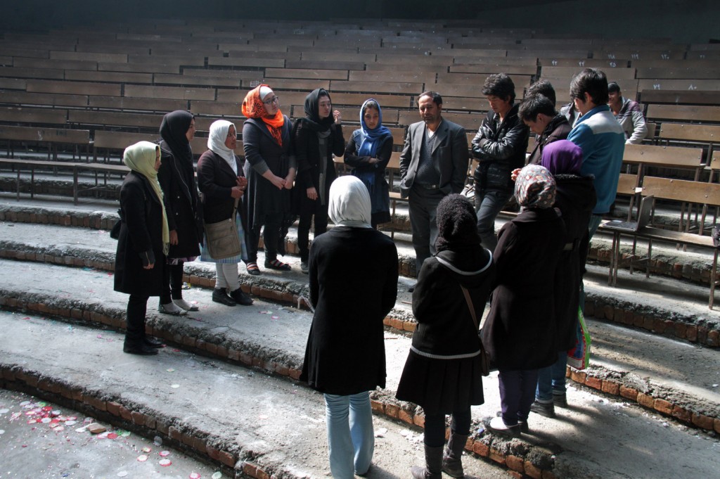 Royesh (center) holds an impromptu class in the auditorium of Marefat School in Kabul. Zabihullah Tamanna for NPR